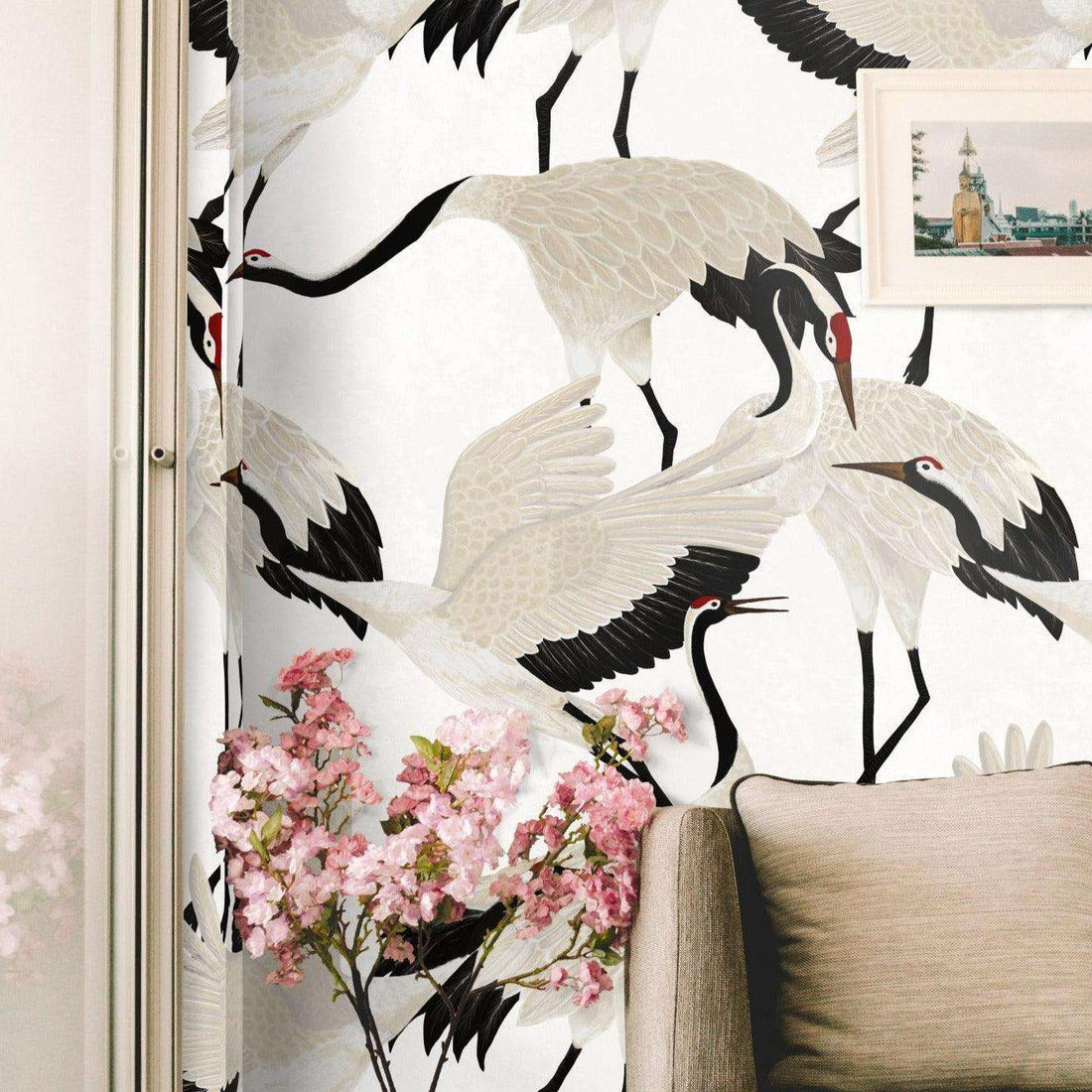 White heron chinoiserie paper wallpaper on a bedroom wall